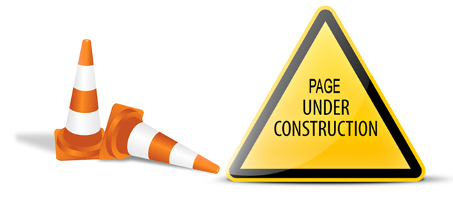 Page under construction sign with traffic cones